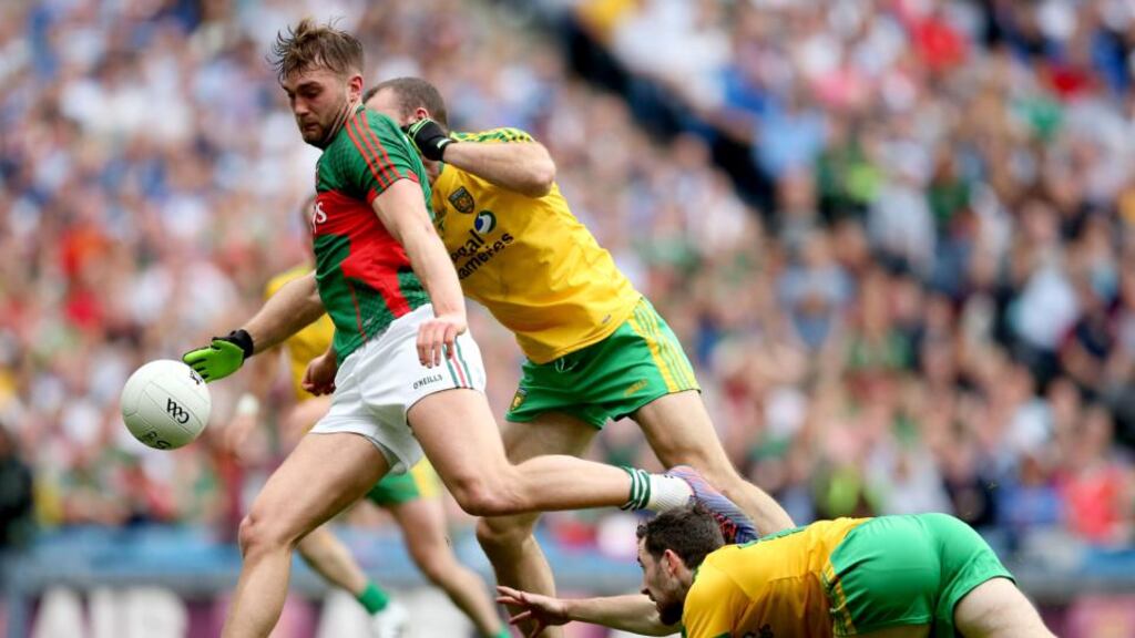 Aidan O’Shea gets away from Donegal’s Neil McGee and Mark McHugh during Saturday’s quarter-final: the Mayo player passed a big test in Croke Park. Photograph: James Crombie/Inpho