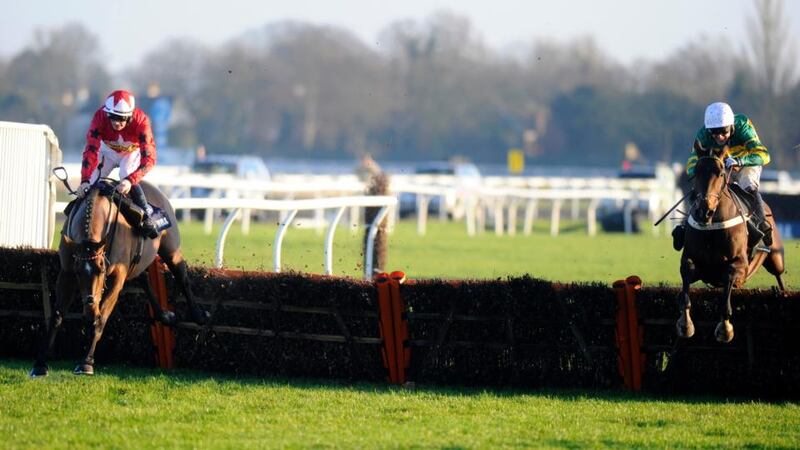 Tony McCoy riding My Tent Or Yours (right) clears the last to win The williamhill.com Christmas Hurdle Race from The New One at Kempton Park. Photograph: Alan Crowhurst/Getty Images