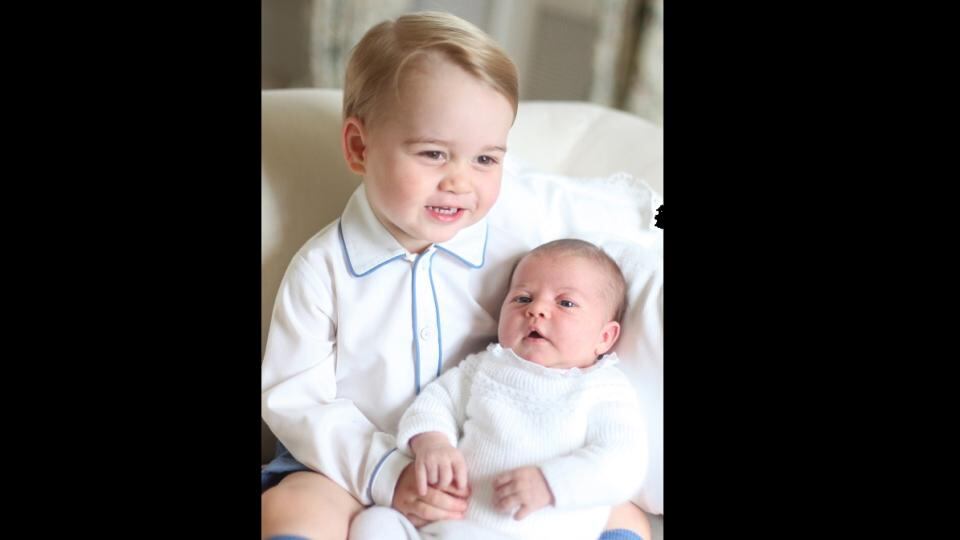 Britain’s Princess Charlotte is held by her brother Prince George in a photograph taken by their mother the Duchess of Cambridge in mid-May at Anmer Hall in Norfolk. Photograph: Duchess of Cambridge via PA Wire.