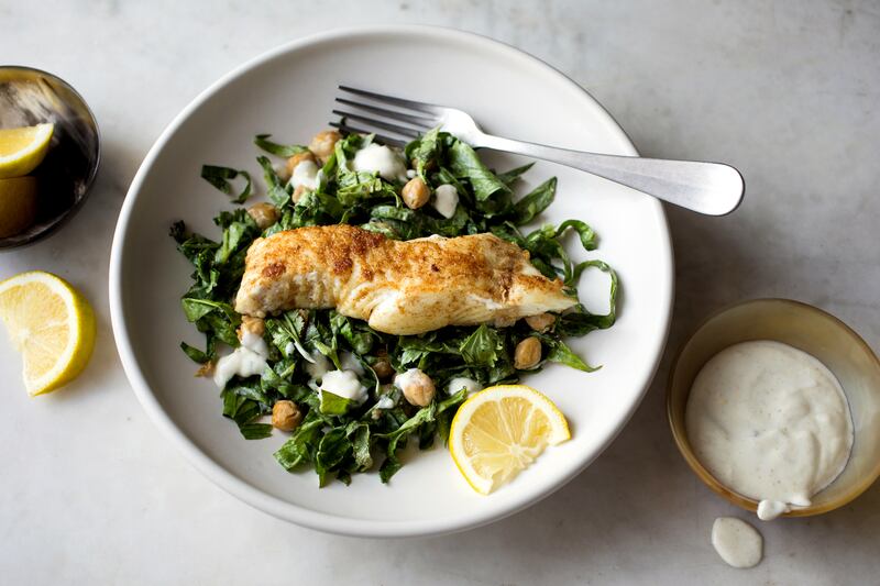 Yotam Ottolenghi’s halibut with spiced chickpea and herb salad. Photograph: Andrew Scrivani/New York Times