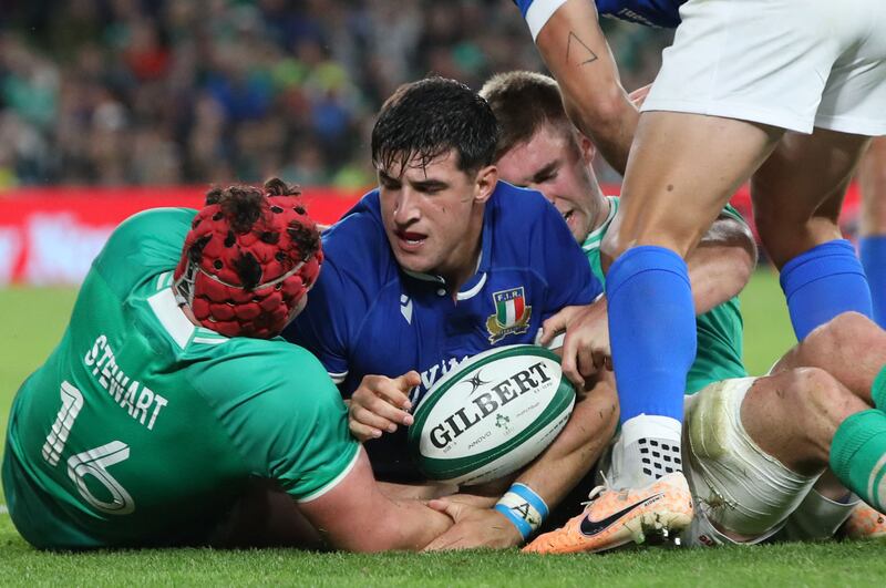 Italy centre Tommaso Menoncello scores the team's second try against Ireland. He later left the pitch in tears after suffering an injury. Photograph: Paul Faith/AFP via Getty Images)