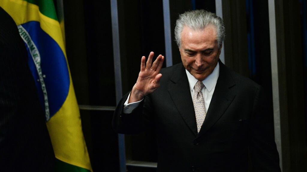 President Michel Temer waves as he takes office before the plenary of the Brazilian Senate in Brasilia, on August 31st, 2016. Brazil’s Dilma Rousseff was stripped of the country’s presidency in an impeachment vote Wednesday and replaced by her bitter rival Michel Temer, shifting Latin America’s biggest economy sharply to the right. Photograph: Andressa Anholete/Getty Images