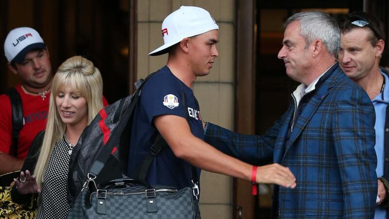 USA’s Rickie Fowler shakes hands with Europe team captain Paul McGinley (right) as he leaves The Gleneagles Hotel. Photograph: Andrew Milligan/PA Wire