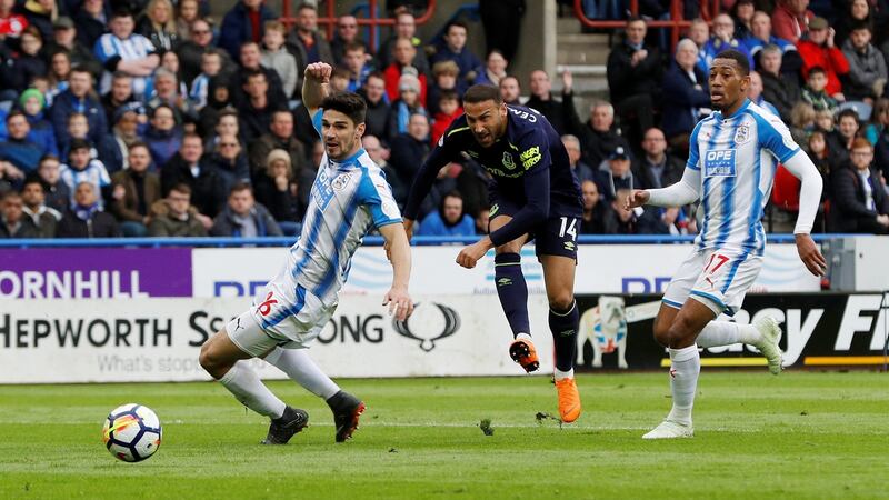 Cenk Tosun scores Everton’s opener against Huddersfield. Photograph: Darren Staples/Reuters