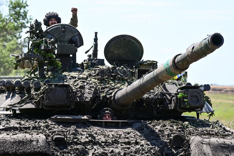 Ukrainian servicemen drive a T-72 tank on the frontline in eastern Ukraine on Wednesday. Photograph: Miguel Medina/AFP via Getty Images