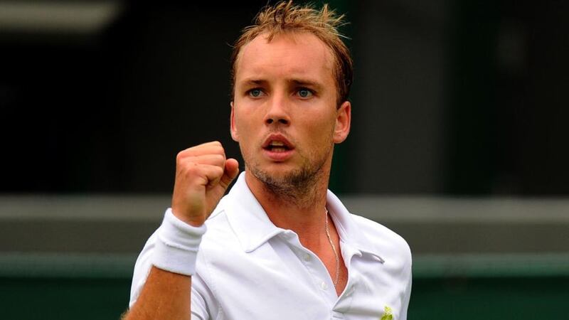 Belgium’s Steve Darcis celebrates winning the first set against Spain’s Rafael Nadal during day one of the Wimbledon Championships. Photograph: Dominic Lipinski/PA Wire