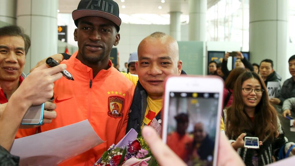 Jackson Martinez, former Atletico Madrid player, poses for pictures with fans at an airport after he joined the Guangzhou Evergrande Taobao FC, in Guangzhou, China last month. Photograph: Reuters