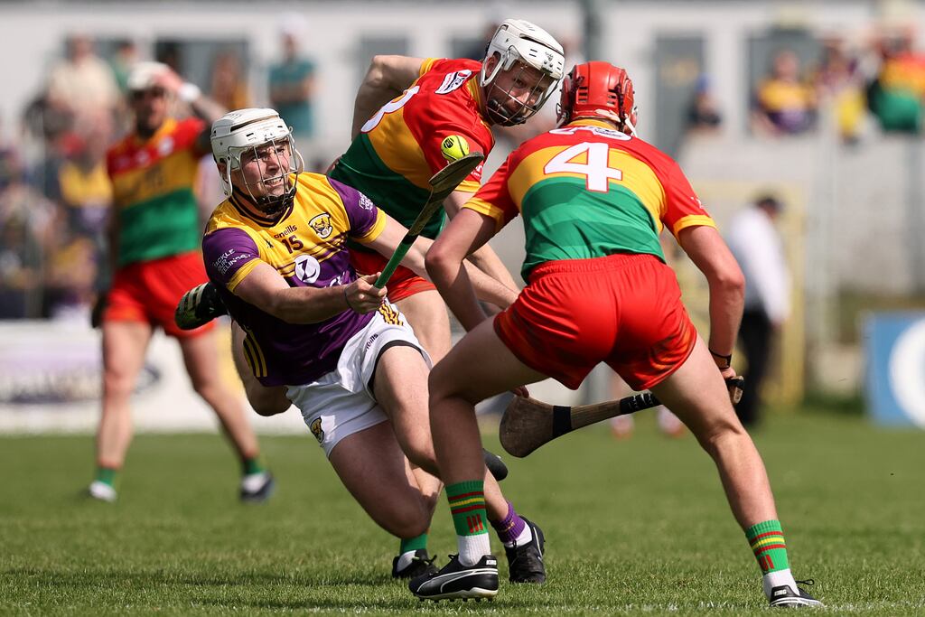 Wexford's Rory O'Connor comes up against Jack Kavanagh and Niall Bolger of Carlow at Cullen Park on Sunday. Photograph: Bryan Keane/Inpho