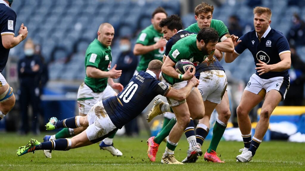 Robbie Henshaw carries during Ireland’s narrow win over Scotland. Photograph: Stu Forster/Getty