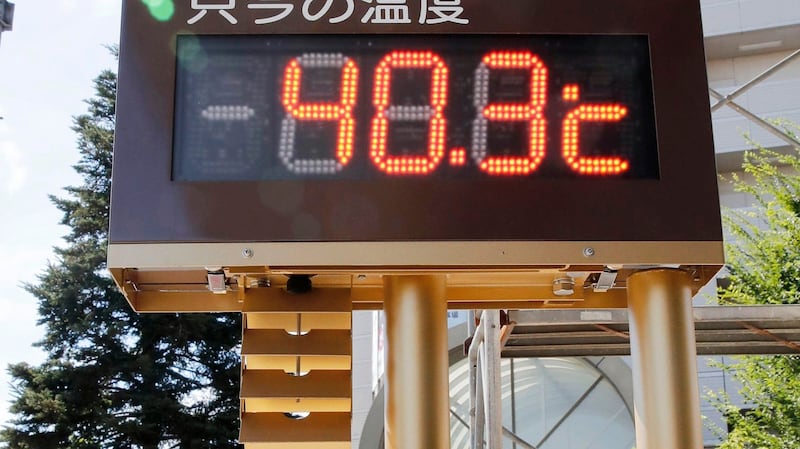 Thermometer reads 40.3 degree Celsius (104.54 degree Fahrenheit) in Kumagaya city, north of Tokyo, Monday, July 23, 2018. Searing hot temperatures are forecast for wide swaths of Japan and South Korea in a long-running heat wave. The mercury is expected to reach 39 degrees Celsius (102 degrees Fahrenheit) on Monday, in the city of Nagoya in central Japan and reach 37 in Tokyo. Deaths have been reported almost every day. (Kyodo News via AP)