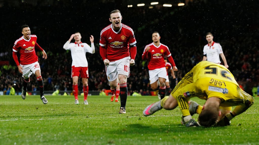 Wayne Rooney scores the only goal of the match as his 92nd-minute penalty goes past Sheffield goalkeeper George Long. Photograph: Jason Cairnduff/Reuters