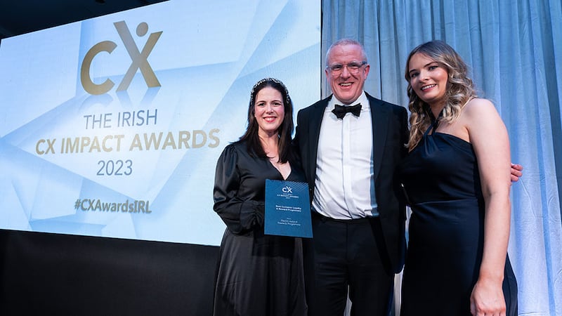 Tim Farmer, awards judge, presents the best customer loyalty & reward programme award to Jillian Saunders and Selena Walsh, Electric Ireland.