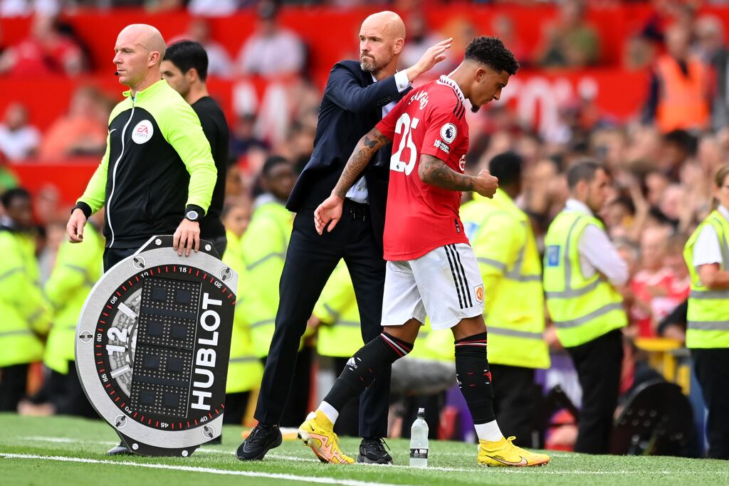 Erik ten Hag interacts with Jadon Sancho of Manchester United. Photograph: Michael Regan/Getty