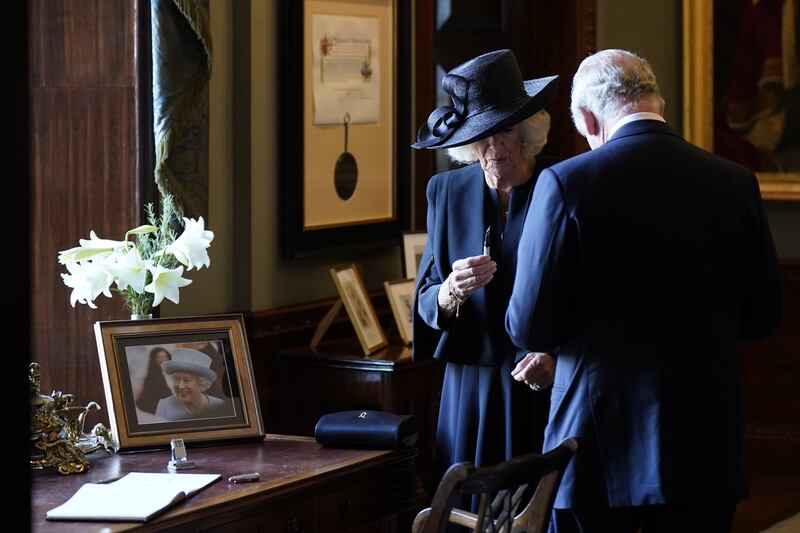 King Charles and the queen consort have problems with a pen as they sign the visitors book at Hillsborough Castle, Co Down. Photograph: Niall Carson/PA