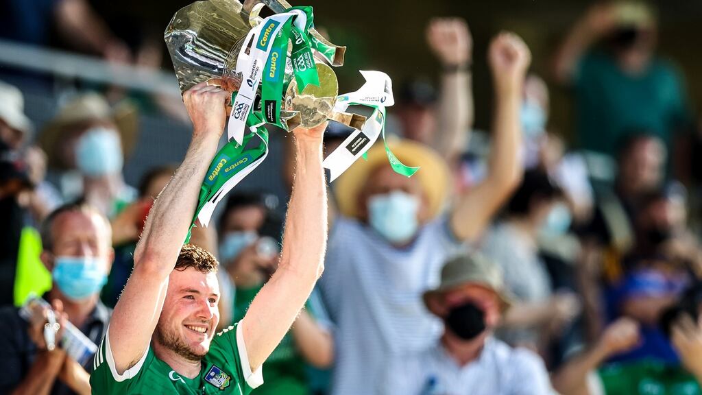 Limerick’s Declan Hannon lifts the Mick Mackey Cup as Limerick are Munster champions. Photograph: Tommy Dickson/Inpho