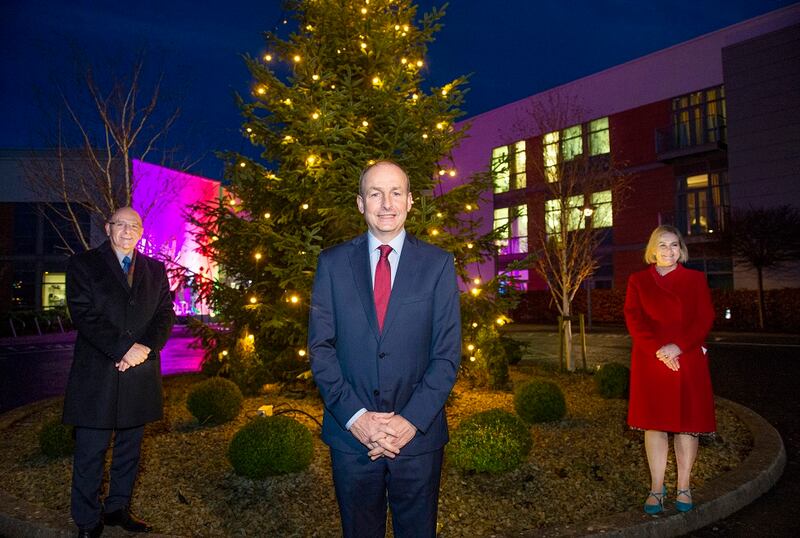 Taoiseach Micheál Martin with Prof Tony O'Brien and Dr Sarah McCloskey at the switching on of the Christmas lights at Marymount Hospice in Cork. Photograph: Gerard McCarthy