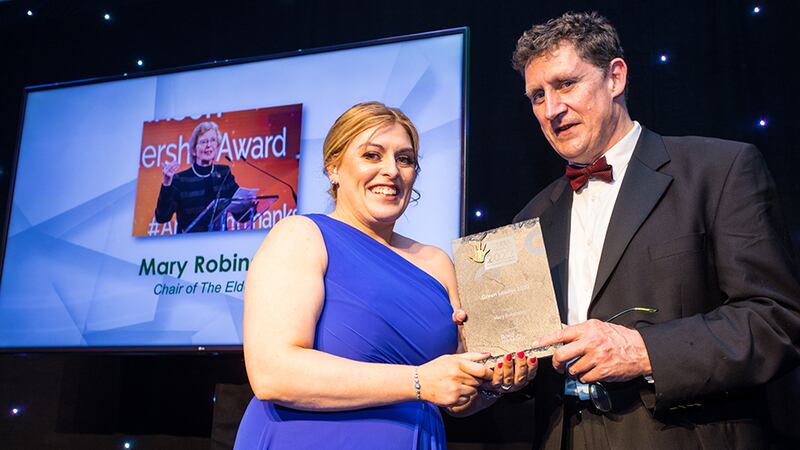 Sharon Doyle, Head of HR at Bord na Móna, presents the Green Leader 2022 award to Minister Eamon Ryan on behalf of Mary Robinson.