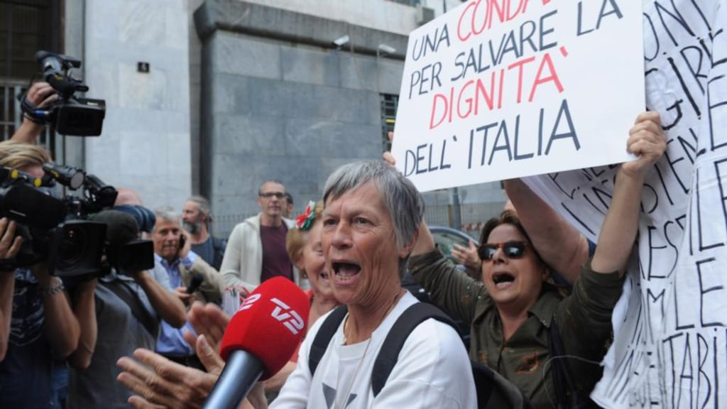Members of the public celebrate after Silvio Berlusconi was sentenced to seven years in prison in Milan yesterday. Photograph: Pier Marco Tacca/Getty Images