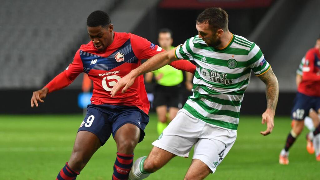 Celtic’s Shane Duffy challenges Lille’s French forward Jonathan David during the Europa League Group H match at the Grand Stade Pierre-Mauroy. Photograph: Denis Charlet/AFP via Getty Images