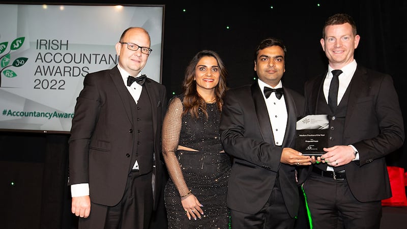 Rohit Garg and Geetika Garg, directors, Axon Outsourcing, present the Medium Practice of the Year award to Noel Winters and Stuart Fitzgerald, Fitzgerald Power.