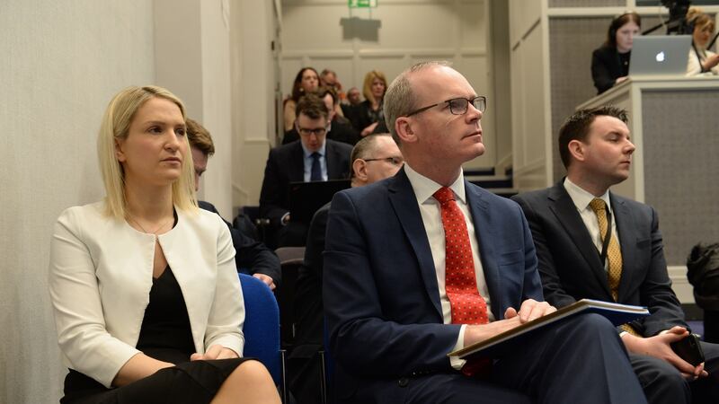 Helen McEntee and Simon Coveney listen to Leo Varaadkar at a press conference in Government Buildings on Tuesday morning. Photograph: Dara Mac Dónaill