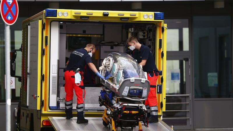 Medical personnel carry an emergency oxygen respiratory bed, which carried the Russian opposition politician Alexei Navalny, in front of the Charité hospital in Berlin. Photograph: Michele Tantussi/Getty Images