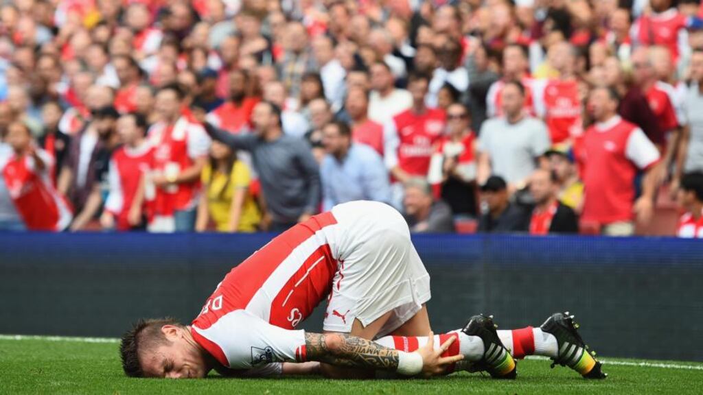 Mathieu Debuchy of Arsenal is facing three months on the sidelines after having surgery on his ankle. Photograph: Shaun Botterill/Getty Images