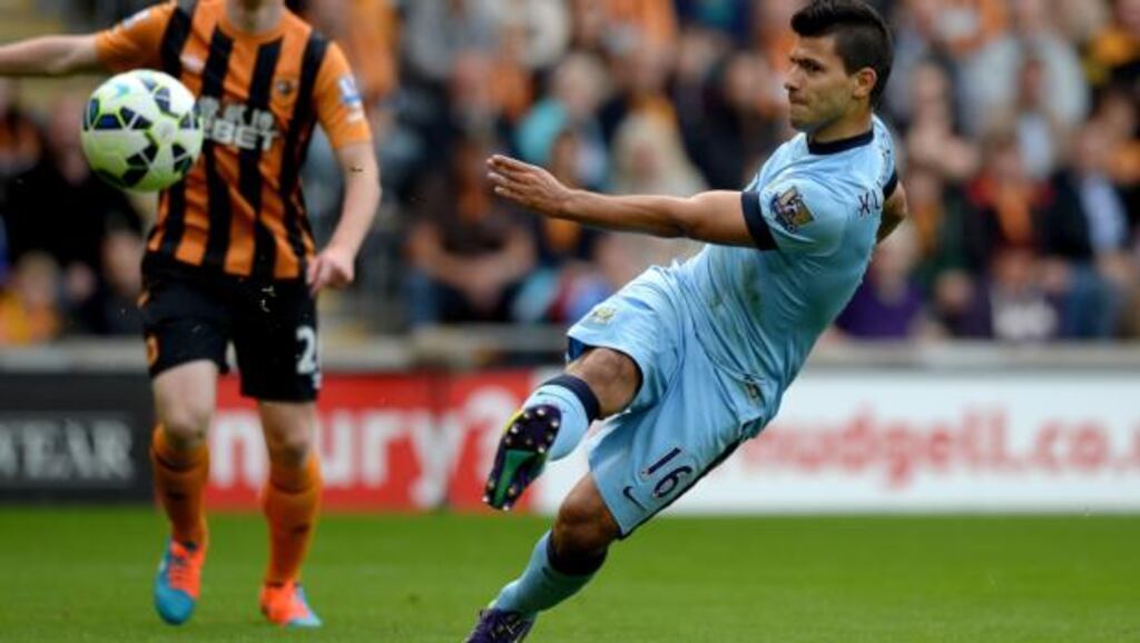 Sergio Agüero of Manchester City scores the opening goal against Hull City   at KC Stadium. Photograph:  Gareth Copley/Getty Images