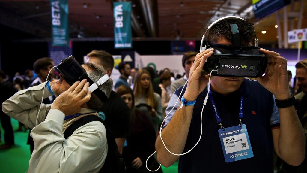 Visitors trying new virtual reality goggles during the second day of the Web Summit in Lisbon. Photograph: EPA/Adre Kosters