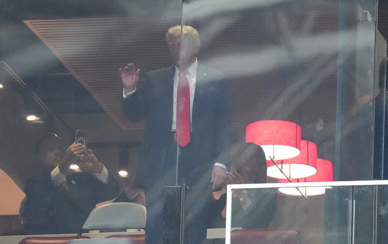 President Donald Trump waves at supporters during a memorial for Charlie Kirk. Photograph: AP