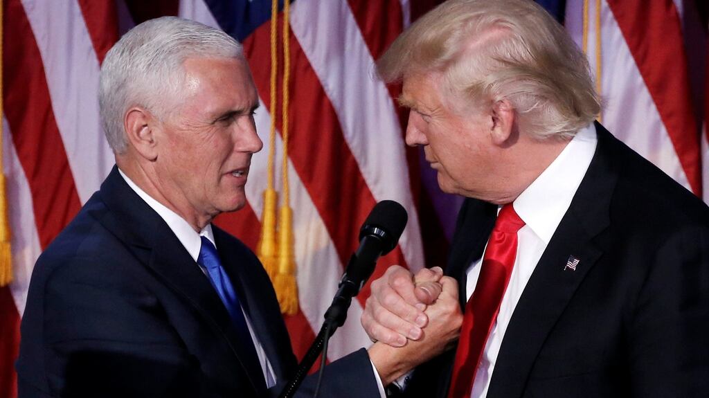 US vice president-elect Mike Pence with Donald Trump at their election night rally. Photograph: Mike Segar/Reuters