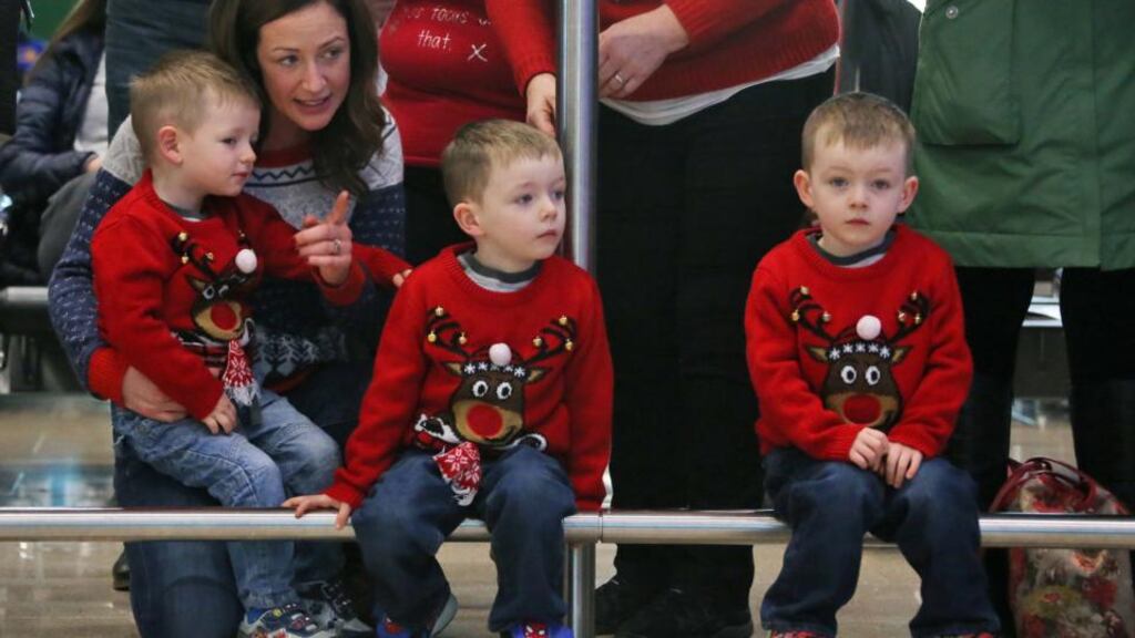 Waiting game: three boys await the arrival of a relative at T2 in Dublin Airport. Photograph: Colin Keegan, Collins Dublin.