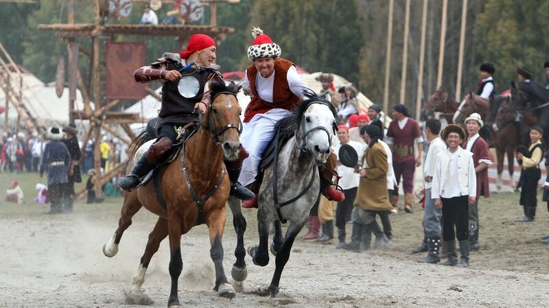 People on horseback during the second World Nomad Games at Issyk Kul lake in Cholpon-Ata, Kyrgyzstan. Photograph: Igor Kovalenko/EPA