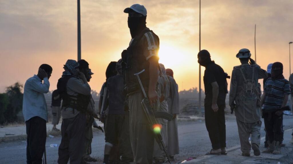 Isis fighters guard a checkpoint in the northern Iraq city of Mosul. Photograph: Reuters