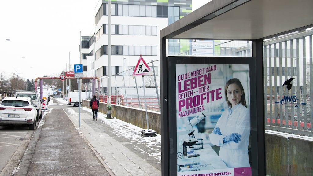 A Peng! Collective poster reading “Your work can save lives, or maximise profits” outside the BioNTech headquarters in Mainz. Photograph: Peng! Collective