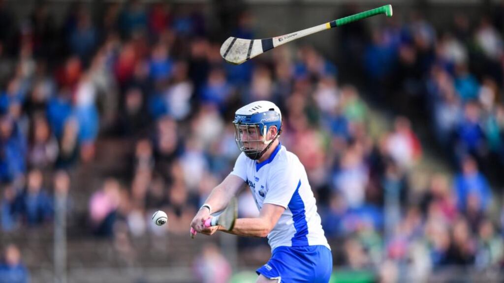 Waterford’s Stephen Bennett keeps his concentration despite a stray hurl to score his second goal in the  Bord Gáis Energy Munster Under-21 Hurling  semi-final against  Clare at Walsh Park. Photograph:   Stephen McCarthy/Sportsfile