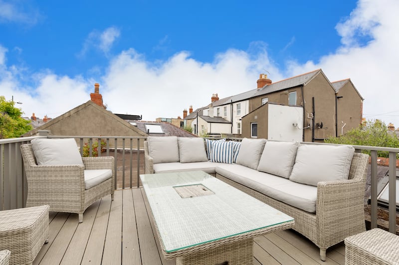 The rooftop terrace with views of the city skyline.