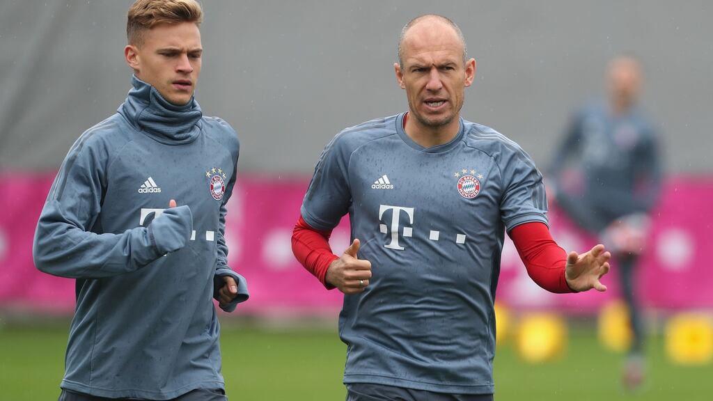 Joshua Kimmich and Arjen Robben of Bayern Munich warm up ahead of their game against Ajax Amsterdam in the Champions League on Tuesday. Photograph: Alexandra Beier/Bongarts/Getty Images