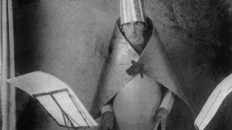 Hugo Ball (1886-1927) Dadaist writer and poet, here wearing a cubist suit made by himself and MarcelJanco for reciting of his poems at Cabaret. Photograph: Apic/Getty