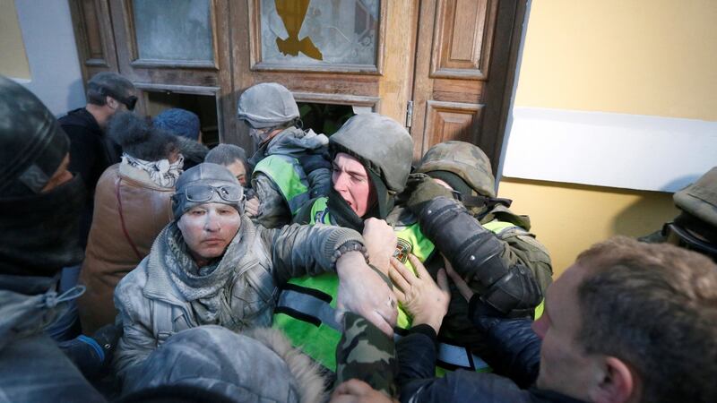 Supporters of former Georgian president and Ukrainian opposition figure Mikheil Saakashvili clash with police in Kiev. Photograph: Valentyn Ogirenko