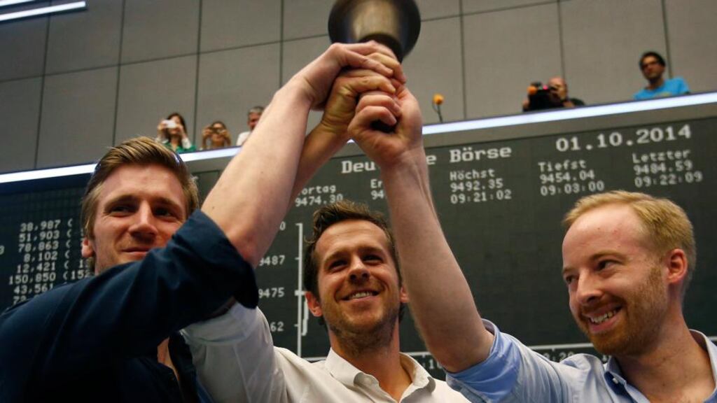 David Schneider, Robert Gentz and Rubin Ritter of Zalando ring the bell during the company’s initial public offering at the Frankfurt stock exchange last year. Zalando has reported a 31.5 per cent increase in first-half revenues to €1.38 billion.