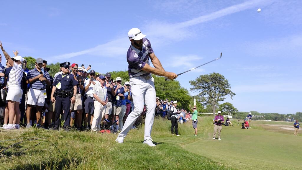 Dustin Johnson chips onto the sixth hole during the third round of the 118th US Open Championship at Shinnecock Hills Golf Club in Southampton, New York. Photo: Justin Lane/EPA