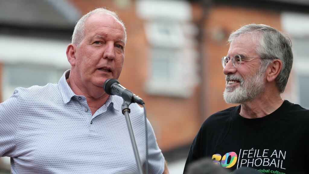 Bobby Storey (left) and Gerry Adams address a rally on Monday night beside the old Andersonstown police station, Belfast, following attacks on their homes last week. Photograph: Niall Carson/PA Wire