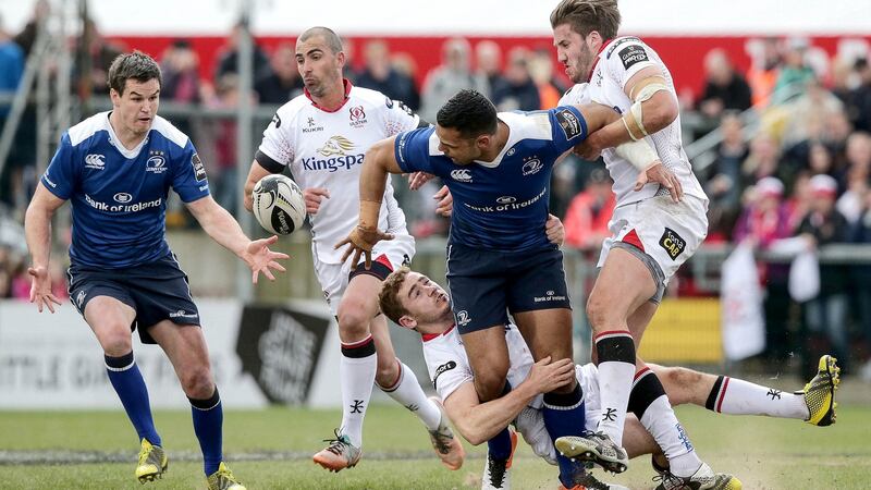 Ben T’eo offloads to his Leinster team-mate Johnny Sexton as he is tackled by Paddy Jackson and Stuart McCloskey of Ulster during the Guinness Pro 12 game at Kingspan Stadium in Belfast. Photograph: Morgan Treacy/Inpho