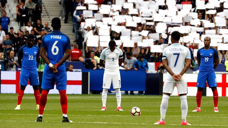 Players observe a minute of silence to honor the memories of the victims of the Manchester and London terror attacks. Photograph: PA