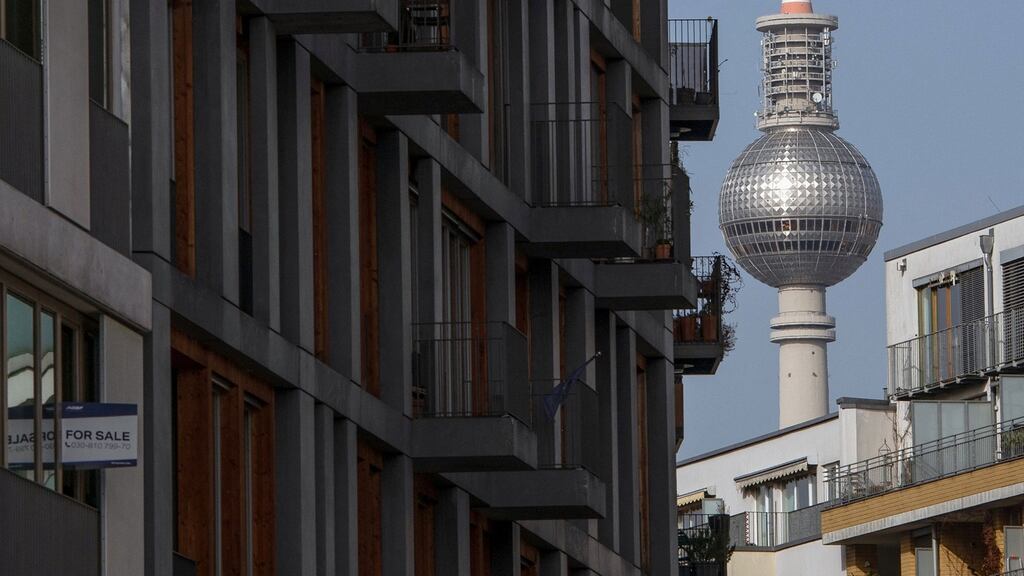 A “For Sale” sign is on display at a block of newly finished apartments in Berlin’s Kreuzberg district with the TV Tower in the background (Photo by David Gannon/AFP via Getty Images)