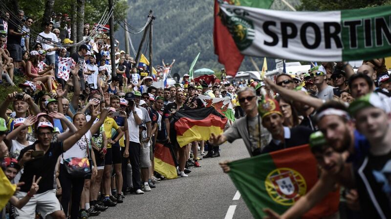 “Being the French national day, the fans were out in their tens of thousands, lining the route, drinking, eating, yelling and doing Mexican waves as we passed.” Photograph: Jeff Pachoud/AFP/Getty Images