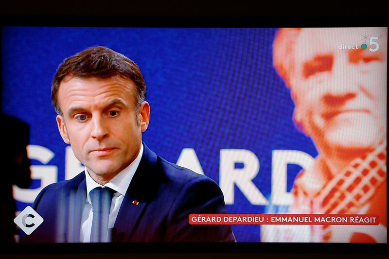 A television screen broadcasting French TV channel France 5 in December 2023 as French president Emmanuel Macron speaks. Photograph: Ludovic Marin/AFP