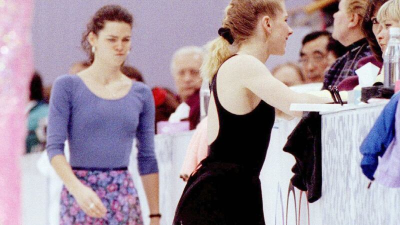 Nancy Kerrigan, left, makes a facial expression as she skates behind Tonya Harding. Photograph: Blake Sell/BPA/Reuters