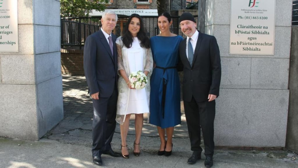Adam Clayton and his new wife Mariana Teixera pose with The Edge and his wife Morleigh outside the registry office in Dublin in which they got married today. Photograph: Mark Doyle